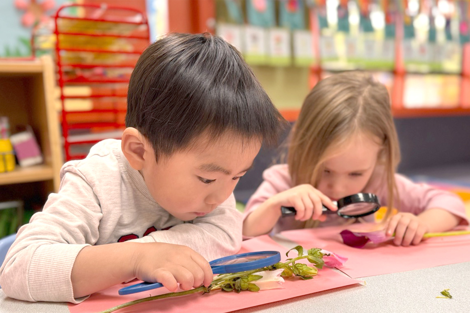 Children exploring hands-on learning materials at Laguna Hills Montessori-early childhood education center.