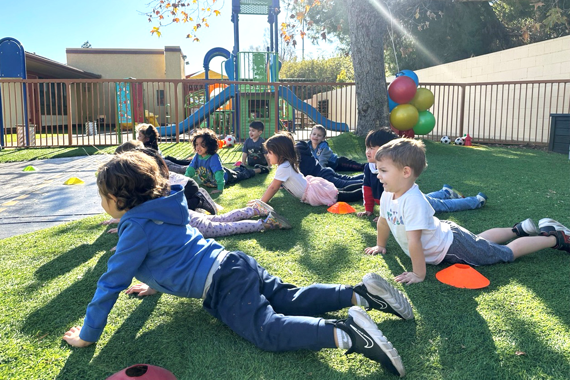 Children participating in a group activity at Aliso Viejo Montessori Childcare Center